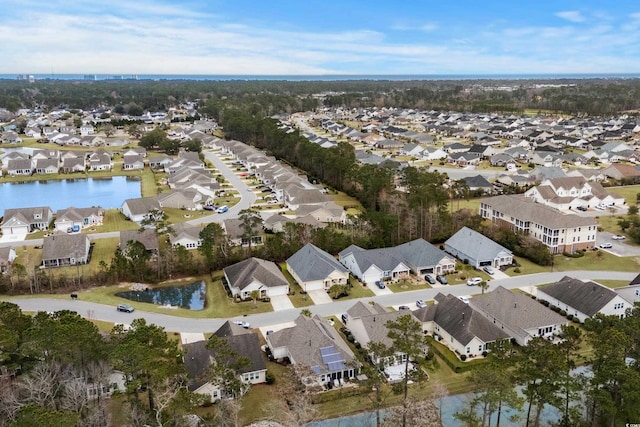 birds eye view of property with a residential view and a water view