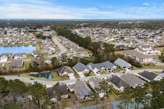bird's eye view with a residential view and a water view