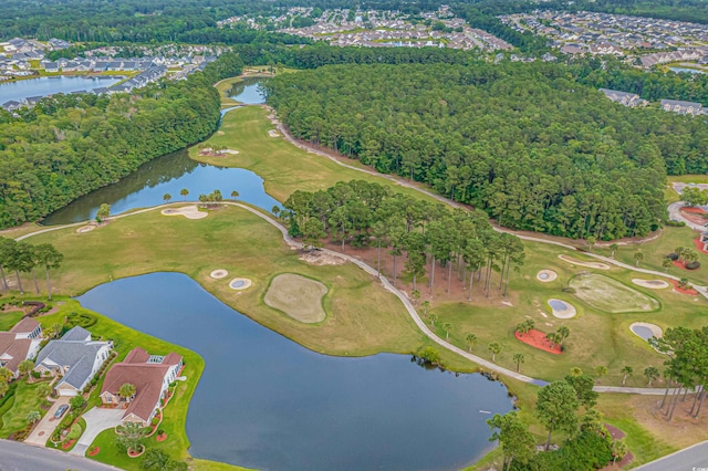 bird's eye view featuring view of golf course, a water view, and a view of trees
