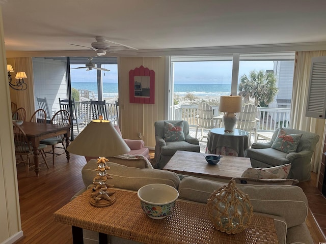 living room with a water view and wood finished floors