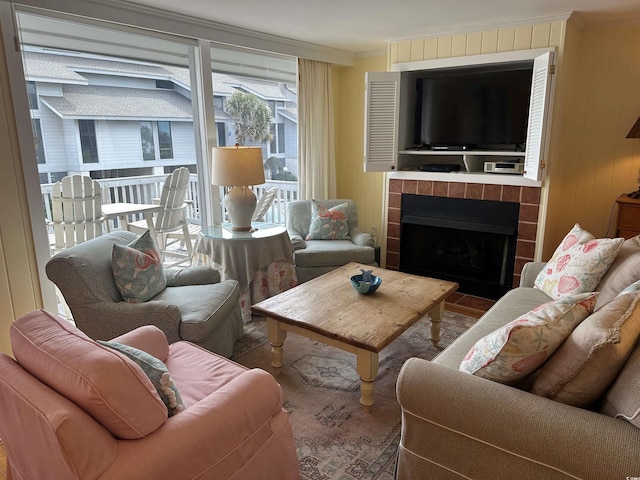 living room featuring a fireplace and crown molding