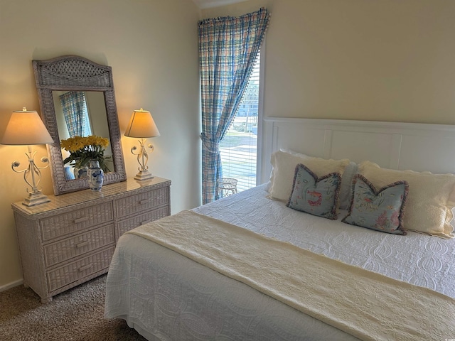 carpeted bedroom with wainscoting