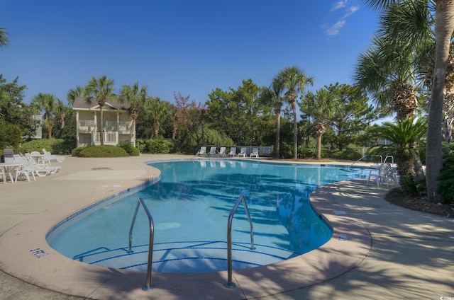 community pool with a patio