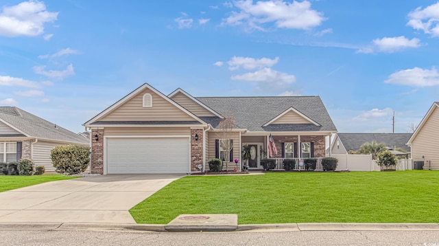 view of front of home with brick siding, an attached garage, concrete driveway, and a front lawn