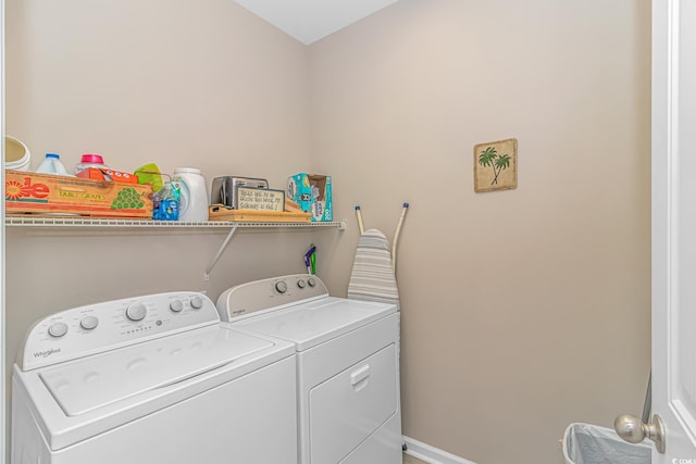 laundry area with baseboards, independent washer and dryer, and laundry area