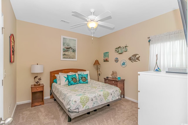 bedroom featuring light carpet, visible vents, a ceiling fan, and baseboards