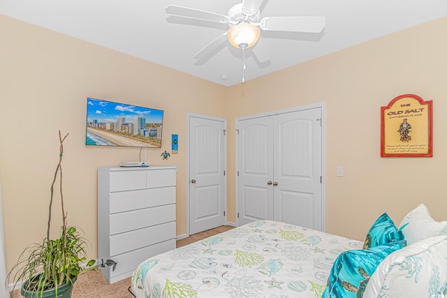 bedroom featuring a ceiling fan and a closet