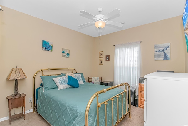 bedroom with baseboards, light carpet, and a ceiling fan