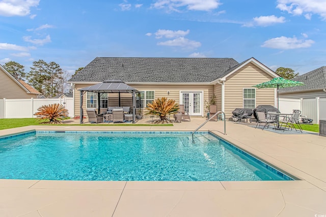 view of swimming pool with a gazebo, a fenced in pool, a fenced backyard, and a patio area