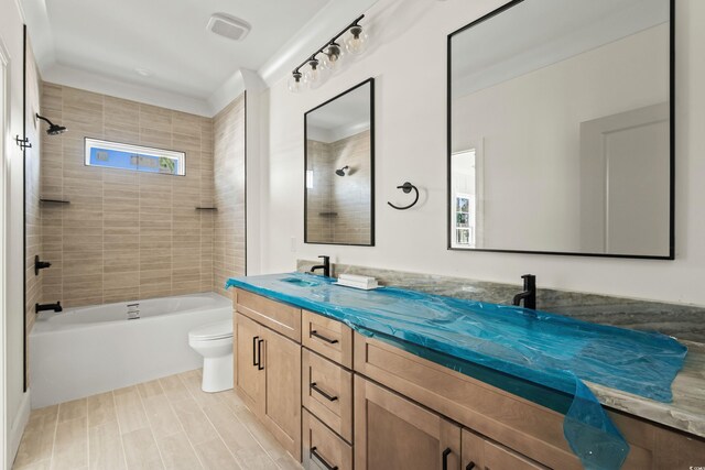 bathroom featuring toilet, shower / tub combination, double vanity, and a sink