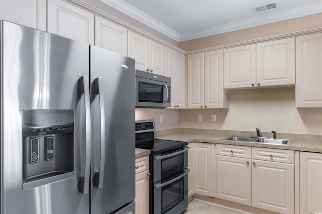 kitchen with visible vents, stainless steel appliances, crown molding, light countertops, and a sink