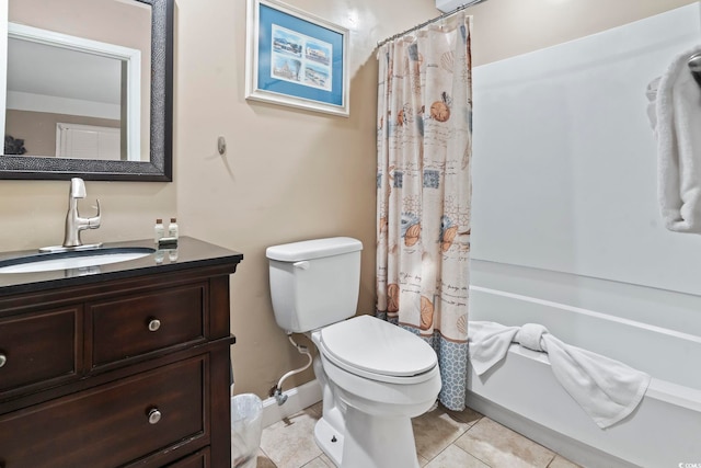 bathroom with a shower with curtain, vanity, toilet, and tile patterned floors