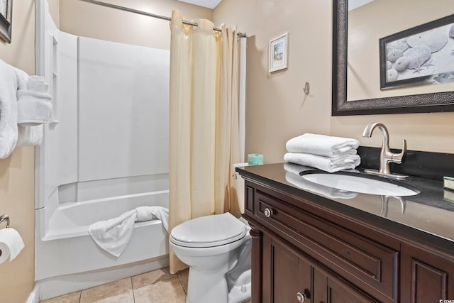 bathroom with vanity, shower / tub combo, tile patterned flooring, and toilet