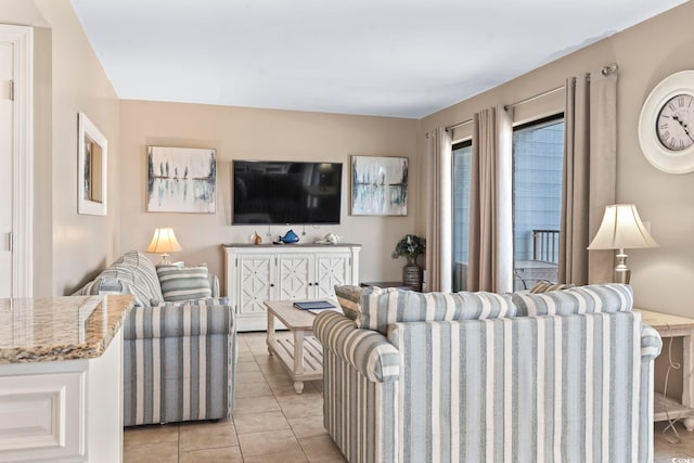 living area featuring radiator and light tile patterned flooring