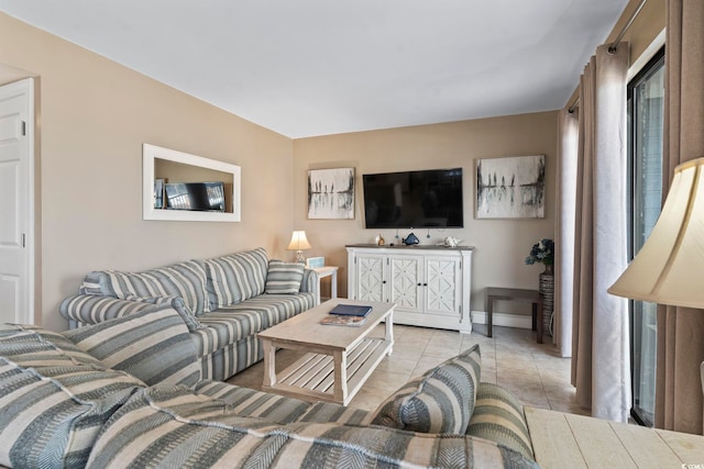 living area with light tile patterned floors