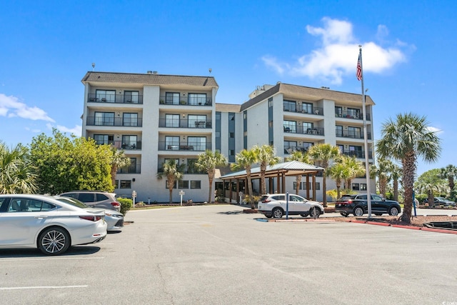 view of property featuring uncovered parking