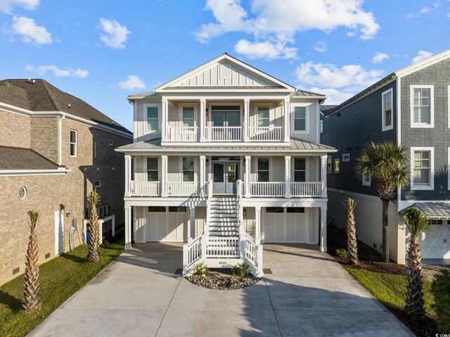 beach home featuring board and batten siding, a porch, stairs, metal roof, and a standing seam roof
