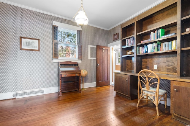 office area with crown molding, built in desk, baseboards, hardwood / wood-style floors, and wallpapered walls