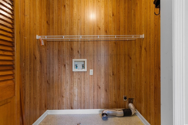 laundry area featuring carpet, hookup for a washing machine, electric dryer hookup, wooden walls, and laundry area