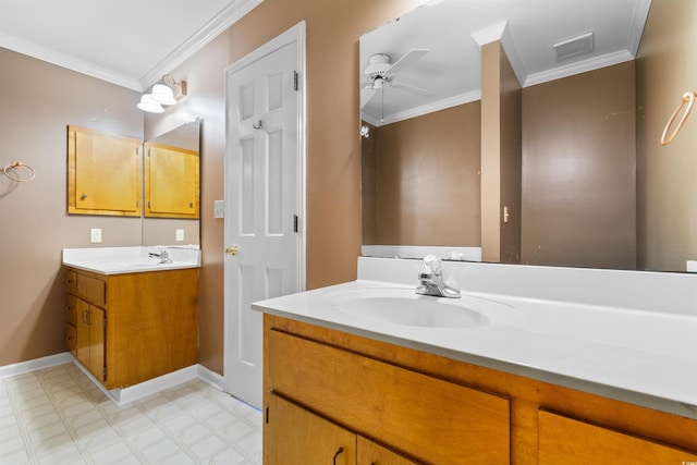 bathroom featuring ornamental molding, visible vents, and a sink