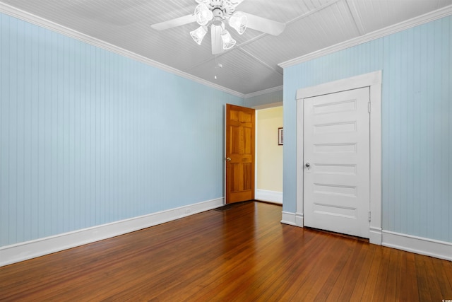 unfurnished room featuring baseboards, ceiling fan, wood-type flooring, and crown molding