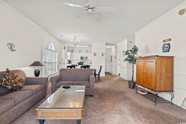 living area featuring crown molding, ceiling fan with notable chandelier, and light carpet