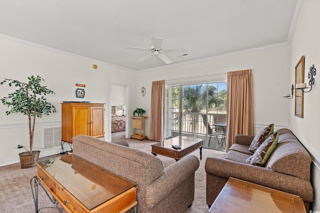 living room with visible vents, light colored carpet, ceiling fan, and crown molding