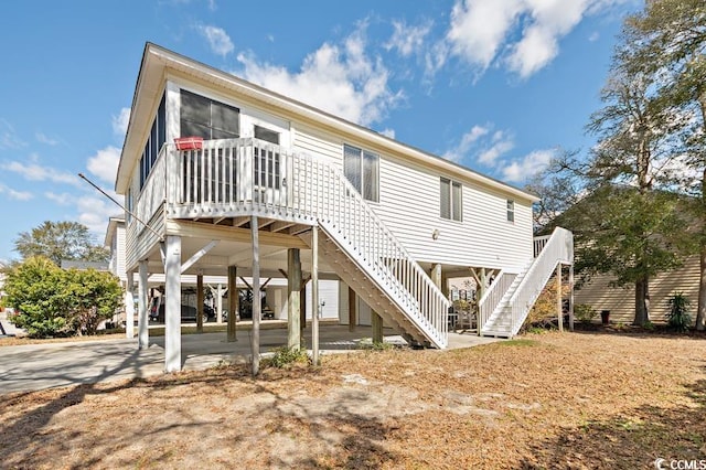 rear view of house with stairs