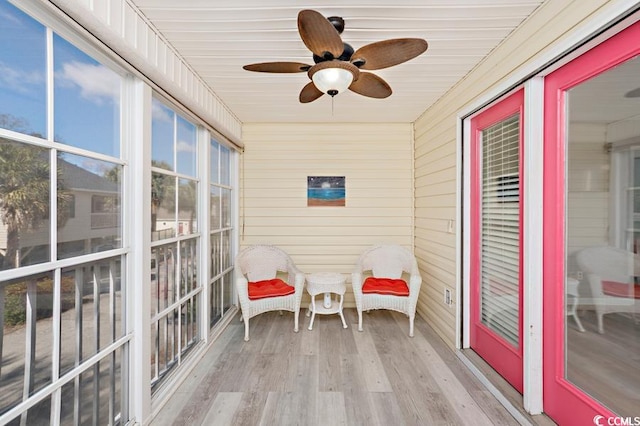 sunroom / solarium with ceiling fan