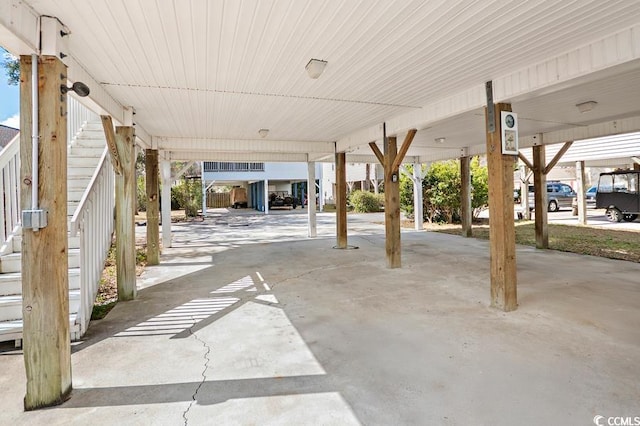 view of patio / terrace with a carport and stairway