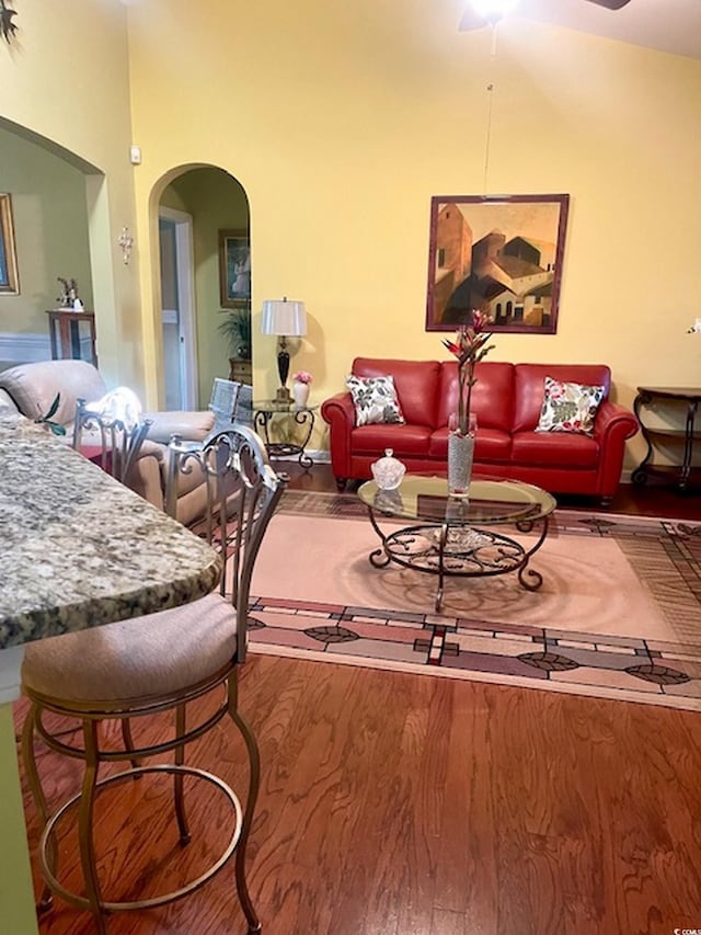 1575 Berkshire Ave, Myrtle Beach, SC 29577 - living area featuring arched walkways, wood finished floors, and ceiling fan