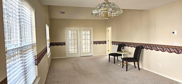 sitting room featuring a notable chandelier, carpet flooring, visible vents, and baseboards