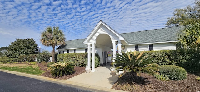 view of front of home featuring a shingled roof