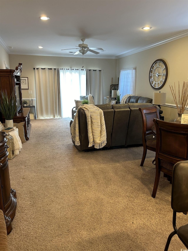 living area featuring crown molding, a ceiling fan, carpet flooring, and recessed lighting