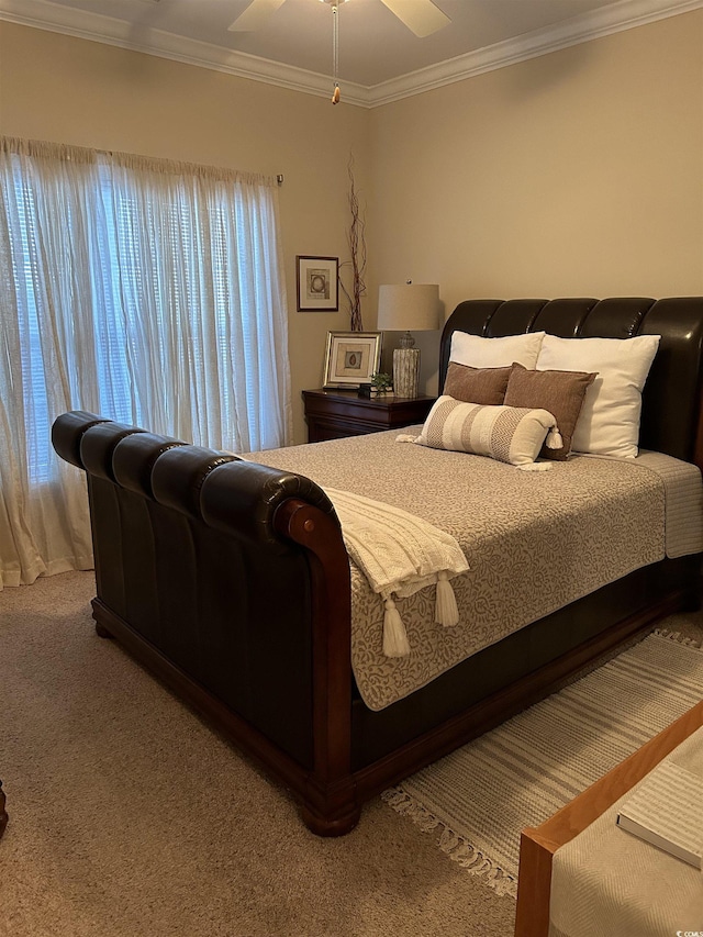 bedroom with ornamental molding and carpet flooring