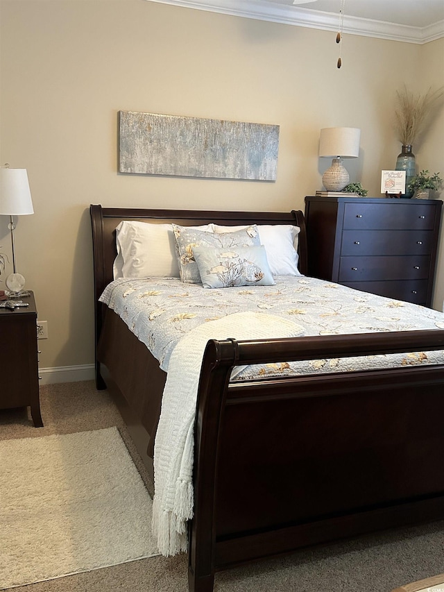 bedroom with light carpet, crown molding, and baseboards