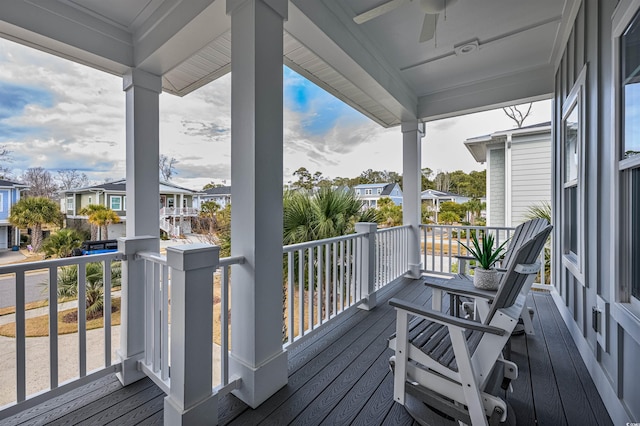 deck featuring a porch, a residential view, and ceiling fan