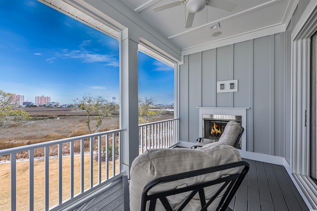 balcony with a ceiling fan and a city view