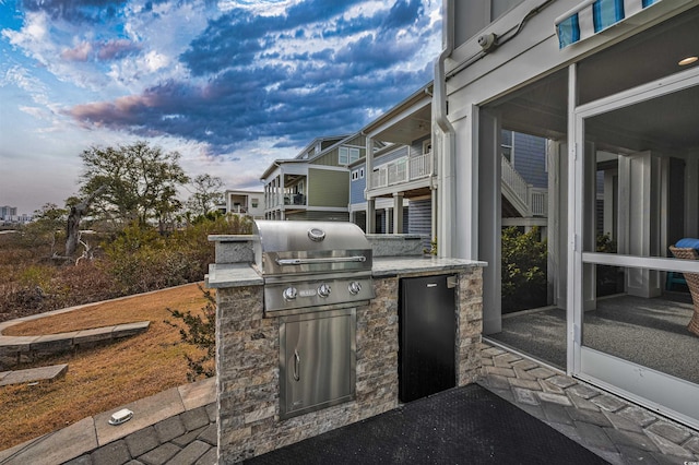 view of patio / terrace with an outdoor kitchen and area for grilling