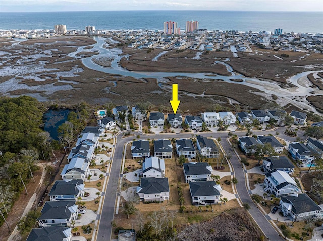 birds eye view of property featuring a water view and a residential view