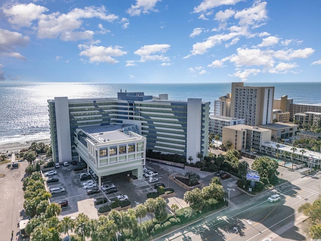 drone / aerial view featuring a water view and a view of city