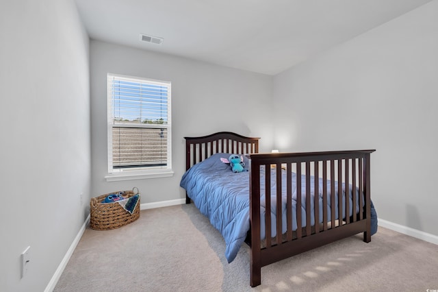 bedroom featuring carpet flooring, visible vents, and baseboards