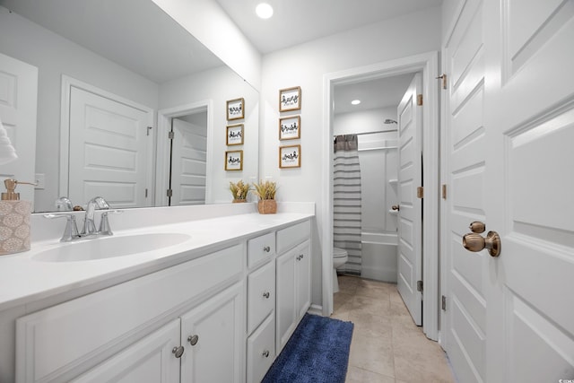 bathroom with recessed lighting, vanity, toilet, and tile patterned floors