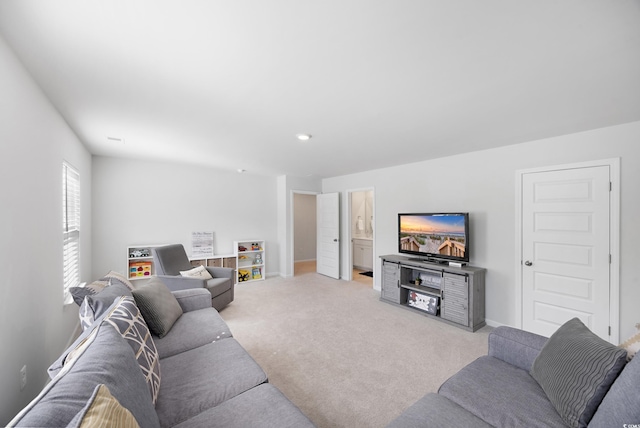 living room with light colored carpet and baseboards