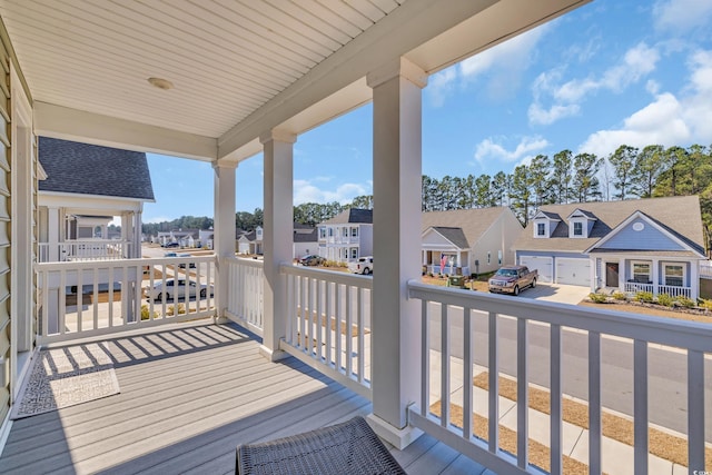 wooden deck featuring a residential view