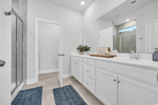 full bathroom featuring a stall shower, visible vents, a sink, and double vanity