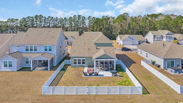 738 Harrison Mill St, Myrtle Beach, SC 29579 - rear view of property with a sunroom, a patio area, and a residential view
