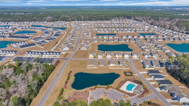 bird's eye view with a water view and a residential view