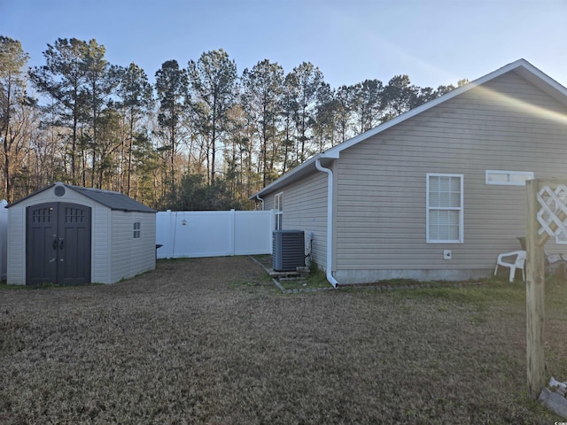 9903 Conifer Ln, Murrells Inlet, SC 29576 - exterior space with an outdoor structure, a shed, a lawn, and central AC unit