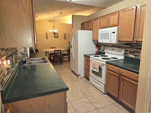 9903 Conifer Ln, Murrells Inlet, SC 29576 - kitchen featuring tasteful backsplash, dark countertops, white appliances, and a sink